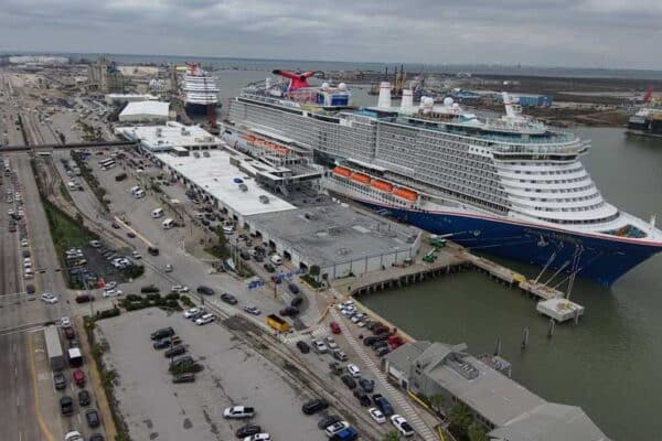 Aerial view of a parking lot, port, and cruise ship.