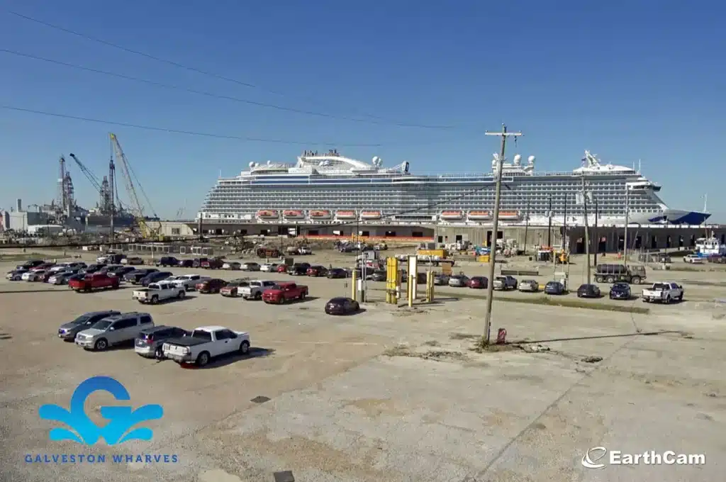 Side view of parking lot with a cruise ship in the background.