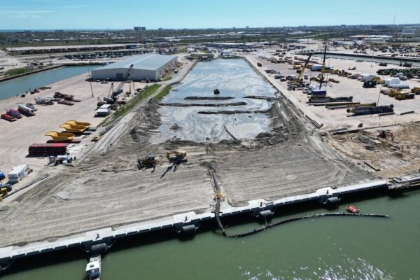 Dredged soil fills the slip at Pier 38-39 to create about 6 acres of new cargo handling area in the West Port Cargo Complex.