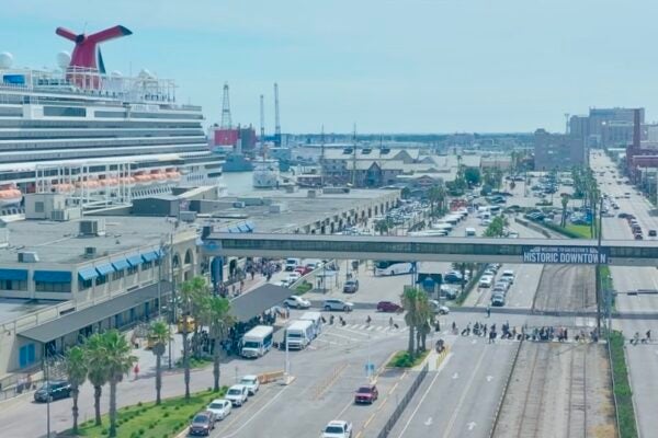 Cruise passengers crossing Harborside at 25th Street to board a Carnival ship.